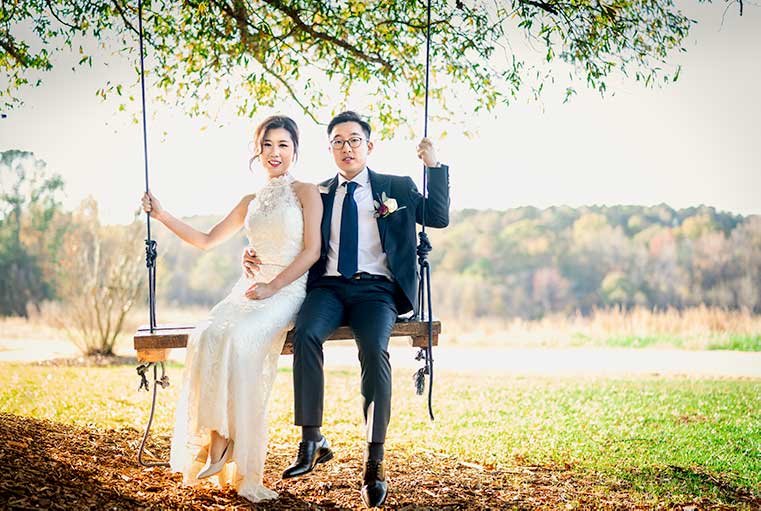 Bride and Groom on the swing at The Meadows