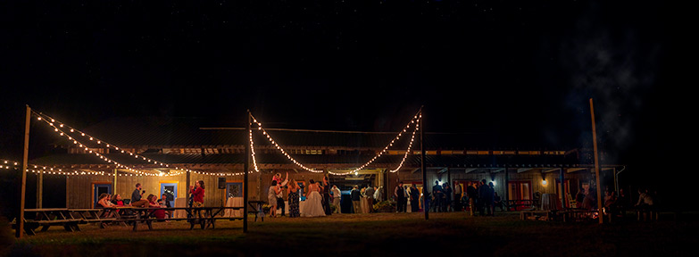 Wedding dancing at night by the bornfire